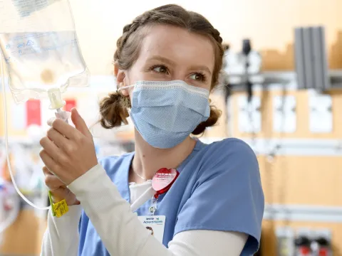 An AdventHealth team member starts an IV.