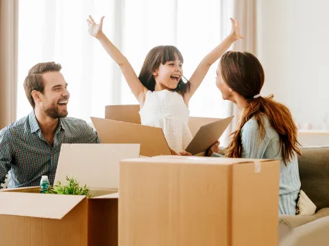Family unpacking boxes