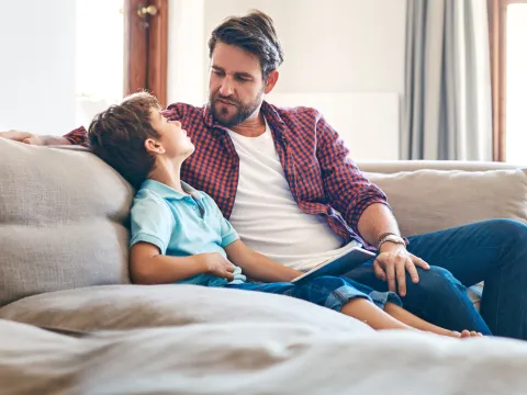 A father and son have a heart to heart conversation. 