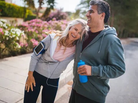 A couple takes a break during a workout.