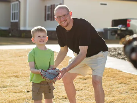 Jay Martin and his son playing baseball