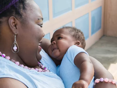 Katrina Grady holding a baby.