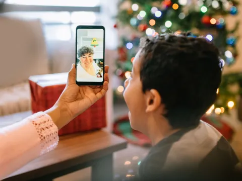 A child video chatting during the holidays.