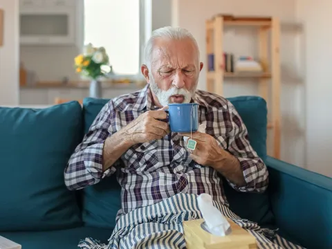 A man drinking tea.