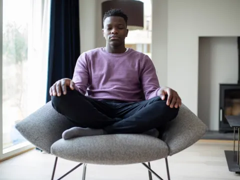 A man practicing visualization techniques. 