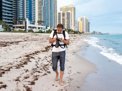 A man walking on the beach.