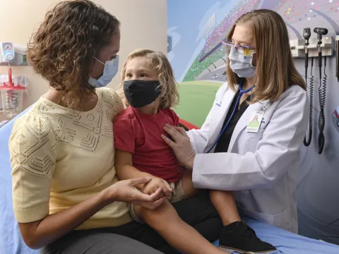 A family in a pediatric emergency room at AdventHealth.