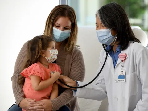 A mother and daughter at a doctor's appointment at AdventHealth.