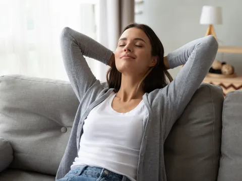 An adult woman rests at home