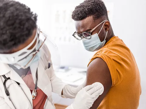 A patient getting cleaned up after a shot