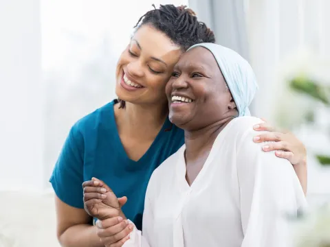 Smiling female patient with nurse