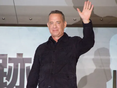 Tom Hanks waves to the crowd.