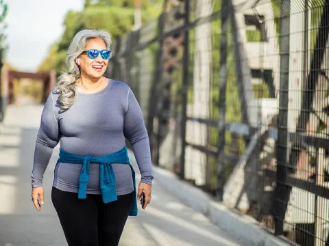 A woman exercising outside. 