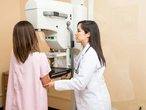 Woman having a mammogram.