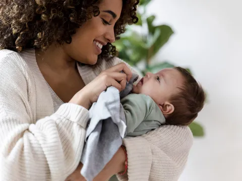 A woman holding her infant.