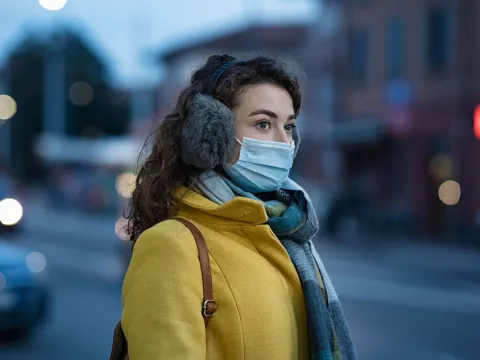 A young woman with winter gear while in her local city.