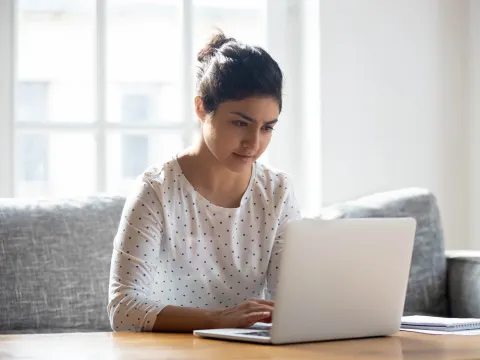 A woman doing research online.