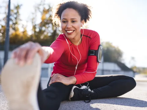 A woman stretching after a run.