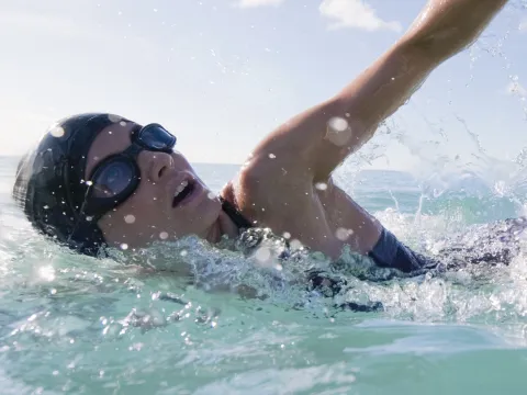 A woman swimming in the ocean.