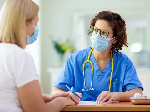 A woman visiting her health care provider. 