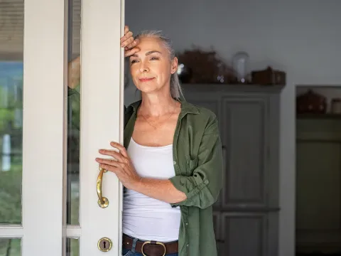 A woman looking outside the window. 