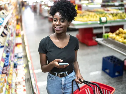 A young woman shops at the grocery store