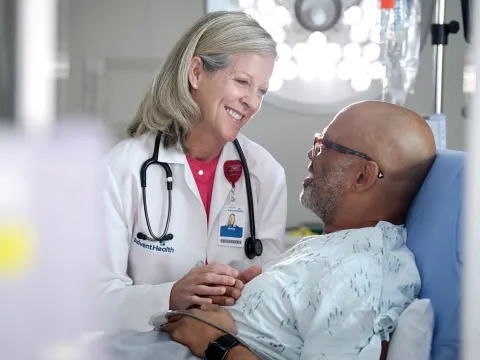 Patient with doctor in Emergency Room.
