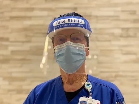 Bill Washburn, 76, RN, has worked at Texas Health Huguley Hospital Fort Worth South since it opened in 1977. Today, he helps administer COVID-19 vaccines at the onsite clinic.