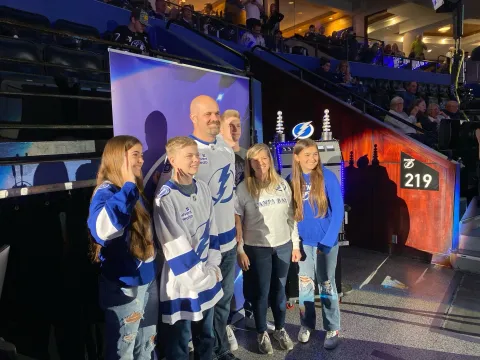 Derek Stock and his family received a standing ovation from thousands of fans
