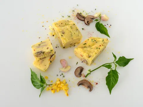 sliced squares of polenta with mushrooms and herbs