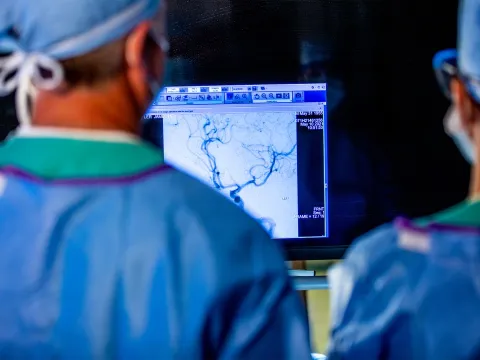 Dr. James Lefler studies a blood clot in a stroke patient