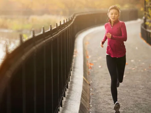 Woman Running on pathway