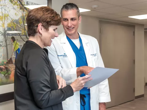 Neurosurgeon Jason Harrison, MD, PhD, with a patient