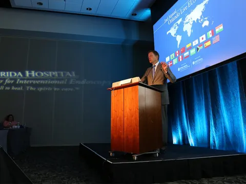 Speaker talking at a conference at a Nicholson Center Education Center room.