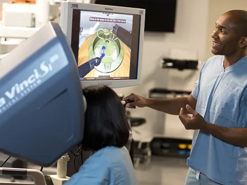 Students at AdventHealth Nicholson Center practicing on a da Vinci machine.