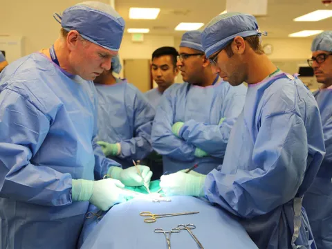 Surgeons Around Operating Table.