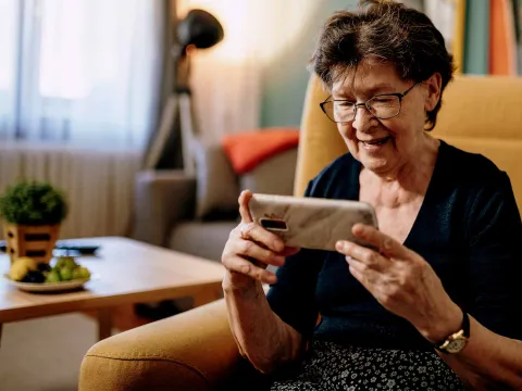 An older woman using video chat. 