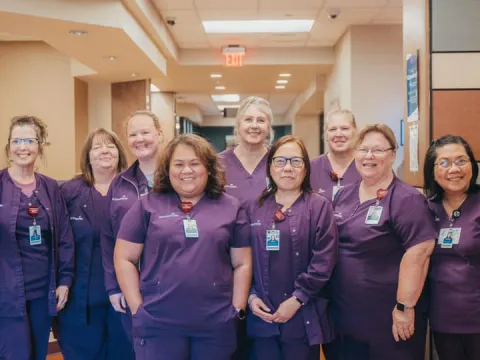 ottawa nursing department wearing purple scrubs