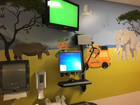 Child friendly murals on an ER room wall