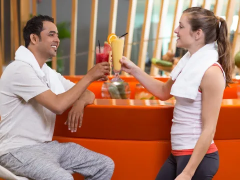 Gym customers holding smoothies