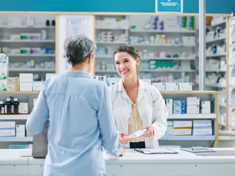 A pharmacist talking with a customer