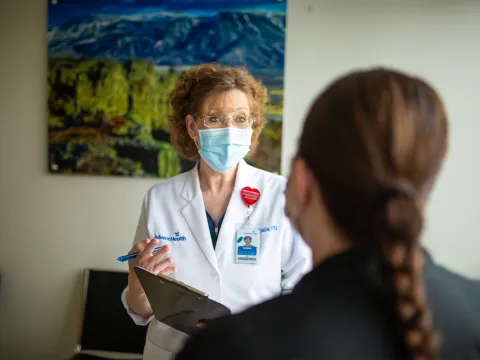 Physician talking with a patient.