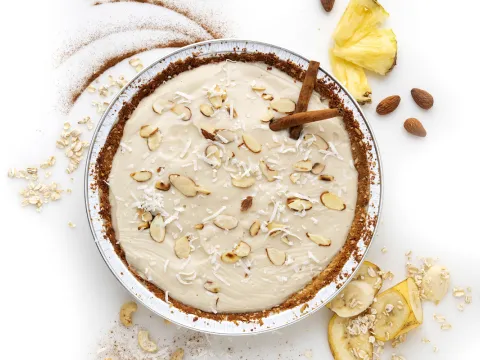 Whole pina colada pie in tin pie plate.