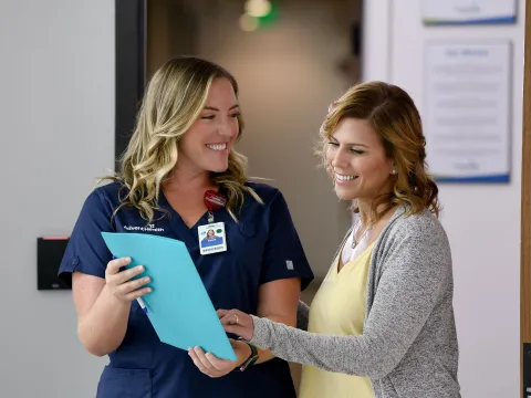 Nurse talking to patient.