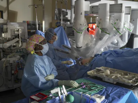 Vipul Patel and his team using robotics during surgery.