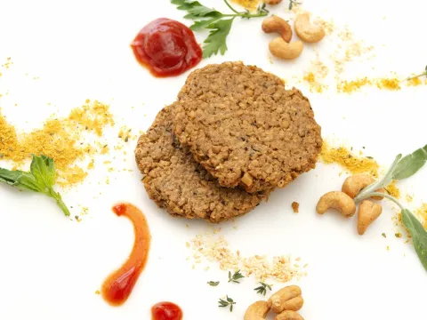 Two homemade cashew and oat-based patties