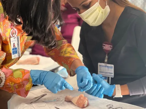 Family Medicine Residency team members doing surgery exercise