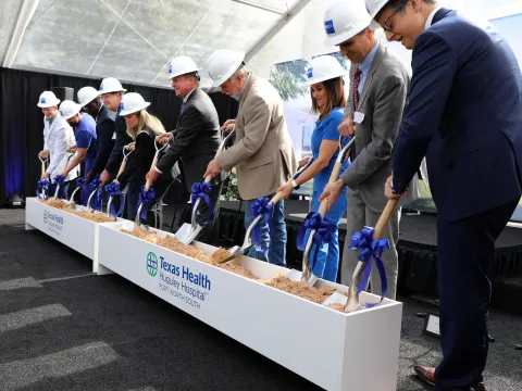 Community leaders, elected officials, staff and executives gather to break ground on new patient care tower.