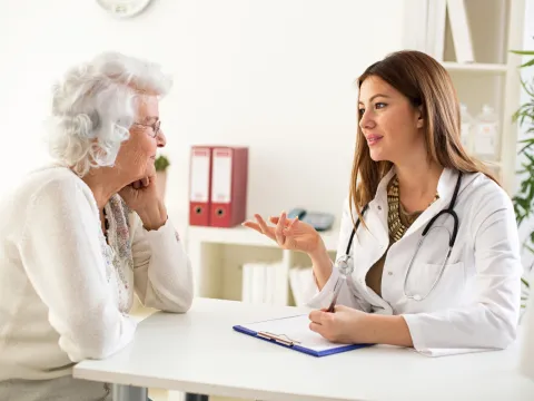 female physician talking to female patient