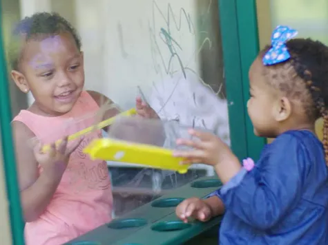 Two children playing together.